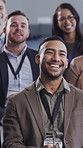 Audience, laughing or happy man with presenter at convention, corporate training or joke for lecture. Speaker, business humor or person in crowd for skill development, learning or funny presentation