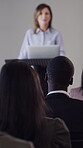 Podium, listen and woman with audience for conference, learn and sales presentation for skill development. Corporate  training, people and speaker with tech for knowledge, business advice and seminar
