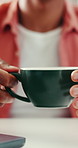 Hands, business and person with coffee in office for caffeine start, morning routine and wellness. Employee, laptop and cup with warm beverage, espresso drink or work break in workplace for breakfast