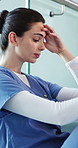 Frustrated woman, nurse and headache with stress for mistake, clinic fail or procedure. Sad, female person or healthcare worker with depression or strain for bad news or mental health in hospital
