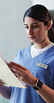 Documents, nurse and reading with woman in hospital for healthcare report, test results and research. Medical history, paperwork and planning with person in clinic for treatment records and folder