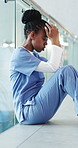 Upset, black woman and nurse with stress in hospital for medical mistake, failure or crisis with burnout. Tired, frustrated and African healthcare worker with fatigue for error at appointment.