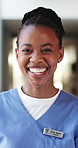 Happy, black woman and face of nurse in hospital with confidence for about us with nursing career. Smile, professional and portrait of African healthcare worker with pride for medical support job.