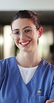 Smile, crossed arms and face of nurse in hospital with confidence for about us with nursing career. Happy, professional and portrait of female healthcare worker with pride for medical support job.