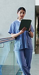 Woman, doctor and intern with tablet in hospital for research, medical report and test results. Person, reading and digital of healthcare schedule, patient history and telehealth for surgery feedback