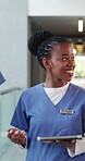 Medical, team or woman in hallway with tablet, collaboration or conversation on patient diagnosis. Healthcare, review and doctors in hospital with tech, advice and discussion for treatment plan.
