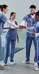 Hands stack, teamwork and doctors in hospital for collaboration, achievement and support in meeting. Happy, healthcare and people with applause for medical service, surgery success and agreement