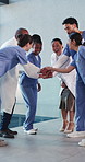 Hands, stack and doctors with nurse in meeting for collaboration, achievement and support. Hospital, healthcare and happy people in huddle for surgery success, agreement and applause for wellness