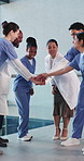 Hands, success and doctors with nurse team for collaboration, achievement and support in meeting. Hospital, healthcare and people with stack to celebrate surgery, solidarity and applause in clinic