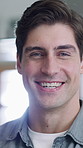 Happy, relax and face of man in home with good mood, positive attitude and smile on break. House, homeowner and portrait of person with confidence, pride and calm on weekend for me time and peace