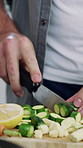 Cooking, vegetables and hands of man in kitchen for meal prep, healthy lunch and dinner recipe together. Home, food and person with ingredients and cutting board for nutrition, vitamins and wellness