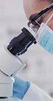 Woman, scientist and exam with microscope for forensic analysis, test or results in laboratory. Female person, inspection or doctor with biotechnology, goggles or mask for medical research in clinic
