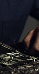 Night, welding and hands of person with motherboard for IT maintenance, repair or diagnostics for software. Dark, technician and worker with tech tools for troubleshooting, system test or programming