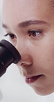 Woman, scientist and microscope at pharma laboratory for medical research, closeup or bacteria for virus. Person, equipment and study sample with molecules, cells or exam for vaccine development