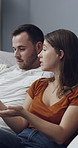 Couple, ignore and conflict with phone on sofa for argument, disagreement or fight in home. Frustrated woman, talking and man with smartphone for separation, toxic relationship or poor communication