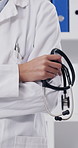 Medical, stethoscope and hands in hospital with arms crossed, confidence or job goals as general practitioner. Wellness, woman or doctor with equipment, about us or career growth in healthcare.