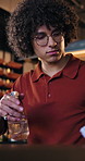 Restaurant, man and cleaning counter with spray for germ sanitation, dust removal and hygiene. Small business, owner and wipe table with cloth for wine bar compliance, safety policy and maintenance