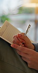 Woman, hands or journalist writing with book for story, schedule planning or reminder in home. Closeup, female person or writer taking notes with pen in notebook for article, ideas or agenda in house