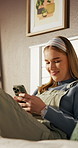 Typing, college student or woman with mobile on bed, reading chat message or funny academic meme. Study break, phone or person laughing at joke post on university forum, notification or smile in home
