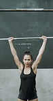 Barbell, portrait or woman in gym with deadlift, bodybuilding power or bicep growth in fitness. Challenge, weightlifting or athlete in club with equipment, intense workout or strength for muscle gain