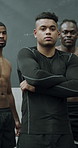 Face, coach and arms crossed with men at gym for bodybuilding, muscle development or fitness. Athlete group, personal trainer or leader at health club for team exercise, strength training or about us