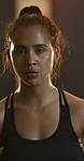 Face, fitness and tired woman in gym, break and breathing for workout recovery with wellness. Portrait, resting and serious athlete with fatigue, intense training and exhausted in exercise club