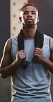 Towel, fitness and face of man in gym with confidence for workout, active or training. Serious, portrait and male person with pride for exercise, wellness or health at sports center in Mexico.