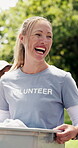 Happy woman, volunteer or charity outdoor with box, outreach support and donation for nonprofit service. Person, laugh and walk in park with container, NGO group or project for social responsibility.