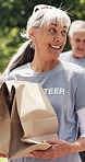 Old woman, volunteer or charity outdoor with package, conversation or donation for nonprofit service. Senior person, parcel and walk in park with NGO group, outreach support or social responsibility.