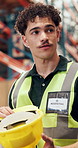 Man, team and helmet at warehouse for safety training, info or explain with vest for logistics. Person, group and show ppe for supply chain, shipping and talk with workshop at distribution plant