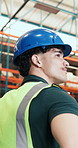 Thinking, distribution and man in warehouse, planning for stock management and logistics. Safety, person and employee in factory, hard hat and decision for supply chain, shipping schedule or solution