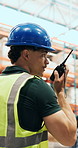 Radio, man and logistics worker in warehouse for inspection with quality assurance for shipping. Technology, talking and male supply chain employee with stock management for cargo service in factory.