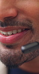 Call center, smile and mouth in office with headset, contact us or advice in crm service. Professional, man and consultant in agency with tech, online assistance or feedback in client support.