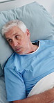 Thinking, above and senior man in hospital bed for medical service, diagnosis and surgery. Healthcare, clinic and elderly person with reflection for recovery, treatment and wellness for procedure