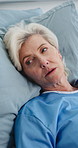 Thinking, tired and senior woman in hospital bed for medical service, cancer diagnosis and surgery. Healthcare, reflection and elderly person with fatigue for recovery, treatment and wellness