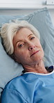 Senior woman, face and sick in hospital bed with rest, recovery and healing for healthcare. Elderly person, exhausted and rehabilitation in portrait, illness and retirement at clinic in Australia