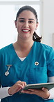 Woman, nurse and face with tablet at clinic for healthcare report, admin or schedule with smile. Person, medical professional and tech on app, checklist and happy in portrait at hospital in Argentina