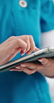 Hands, nurse and typing with tablet at clinic for healthcare report, admin or schedule for job. Person, medical professional and tech with application, checklist and review with notes at hospital
