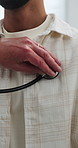Doctor, hands and people with stethoscope for breathe assessment, respiratory exam or advice. Man, medical worker and patient in consultation with heartbeat, cardiology evaluation or check lungs