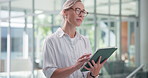 Woman, thinking and typing in office with tablet, insight and planning for social media marketing. Person, glasses and browse in workplace with tech, creative idea and thought for digital branding.