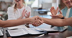Documents, clapping and business people with handshake in office for magazine deal or agreement. Applause, team and creative editor shaking hands with client for publishing with partnership contract.