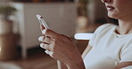 Typing, chat and hands in house with phone, social media scroll or conversation on online platform. Text, space or woman in home with technology, message feedback or internet browse on digital app.