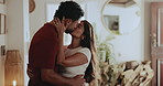 Kiss, love and couple hug in home with connection, care and support partner on valentines day. Romance, happy man and woman with embrace for loyalty, marriage commitment and healthy relationship