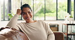 Woman, face and relax on sofa for smile in home, pride and chill in living room with confidence. Mature person, happy and portrait on couch, rest or break on weekend in lounge at house in Colombia