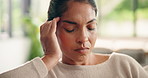 Headache, tired and stress with woman in home for frustrated, fatigue and brain fog. Migraine pain, worry and temple massage with person in living room of apartment for  crisis and overwhelmed
