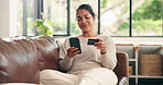 Woman, phone and credit card on couch for ecommerce with smile, easy payment or budget in living room. Person, smartphone and digital banking for online shopping, deal or sale on fintech app at house