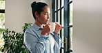 Glass door, woman and thinking with coffee in home to start day, check weather and reflection. Calm, person and thoughtful with hot beverage in apartment for peaceful morning, daydreaming and memory