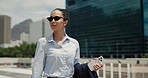 City, sunglasses and travel with lawyer woman outdoor for commute or trip to court location. Buildings, shades and thinking with female attorney walking downtown for morning  journey to law firm