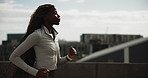 Running, fitness and black woman in city for cardio health, wellness or endurance training. Athlete, jog and person in urban town for sports, exercise or runner practice on bridge for workout outdoor