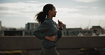 Running, fitness and woman in city for cardio health, wellness and endurance training. Athlete, jog and person in urban town for sports, exercise and runner practice on bridge for workout outdoor